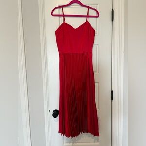 Red pleated midi dress